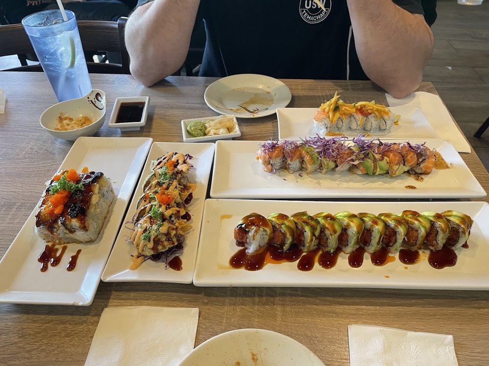 Sushi rolls arranged on a restaurant plate.